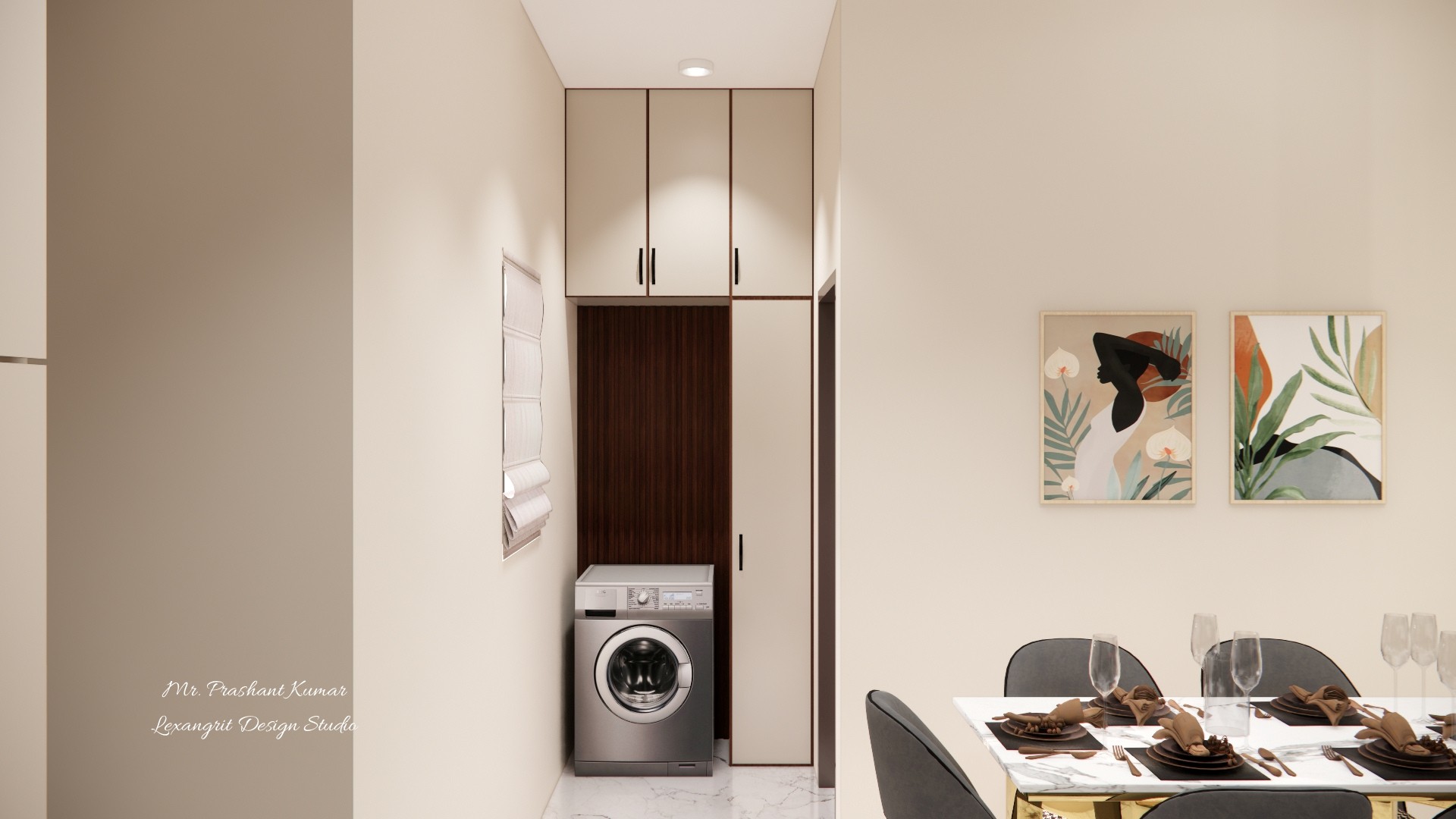 A narrow laundry area integrated into a hallway passage, featuring a front-loading washing machine below dark wood cabinetry and tall beige upper cabinets, adjacent to a dining room with artwork and a set table.