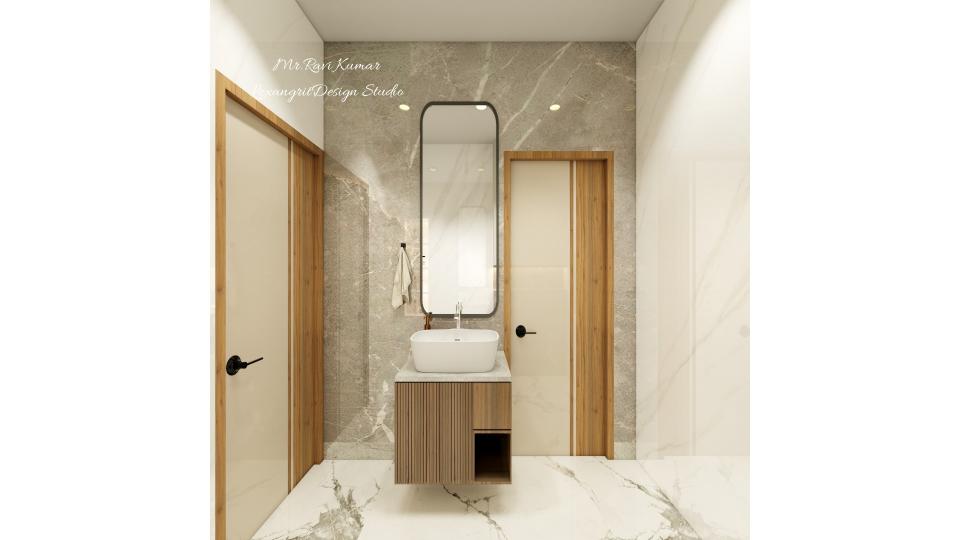 Bathroom vanity area with grey marble accent wall, wooden fluted floating vanity with vessel sink, tall rounded mirror and white marble floor