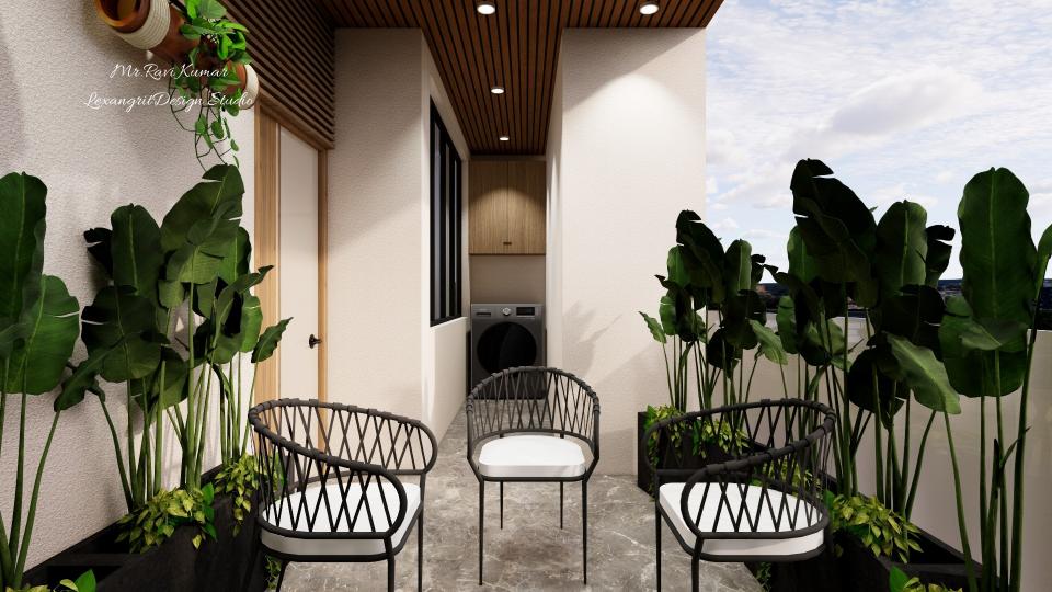 Balcony view toward a laundry nook with a dark grey washing machine under a wooden storage cabinet, planter boxes with tropical plants on both sides, wooden slatted ceiling, and grey granite textured tile flooring.