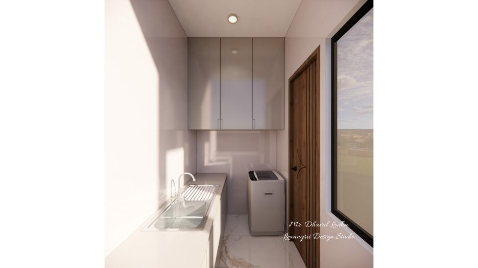 A narrow enclosed balcony laundry room featuring a white top-loading washing machine, a white utility sink with a drainboard, glossy beige overhead cabinets, a wooden door, and a large window on the right.