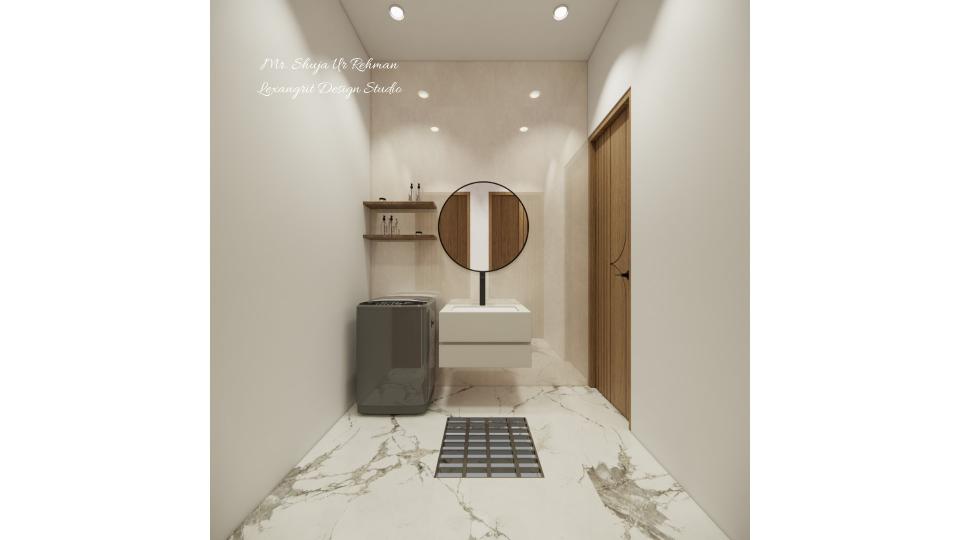 A narrow bedroom passageway utilized as a laundry area, featuring a grey top-loading washing machine next to a floating white vanity sink with a round black-framed mirror, wooden shelves, a wooden door, and a marble-patterned floor with a floor drain.