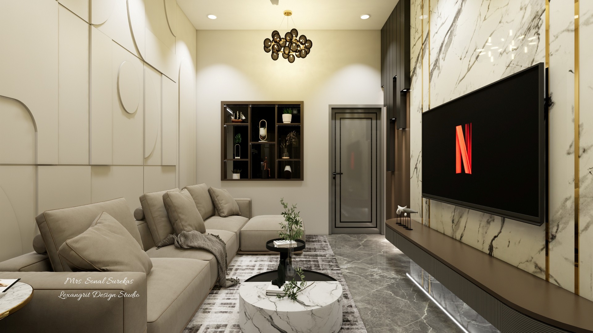 Cream sectional living room with veined marble TV wall, black screen, round coffee tables, display niche, and gray stone floor.