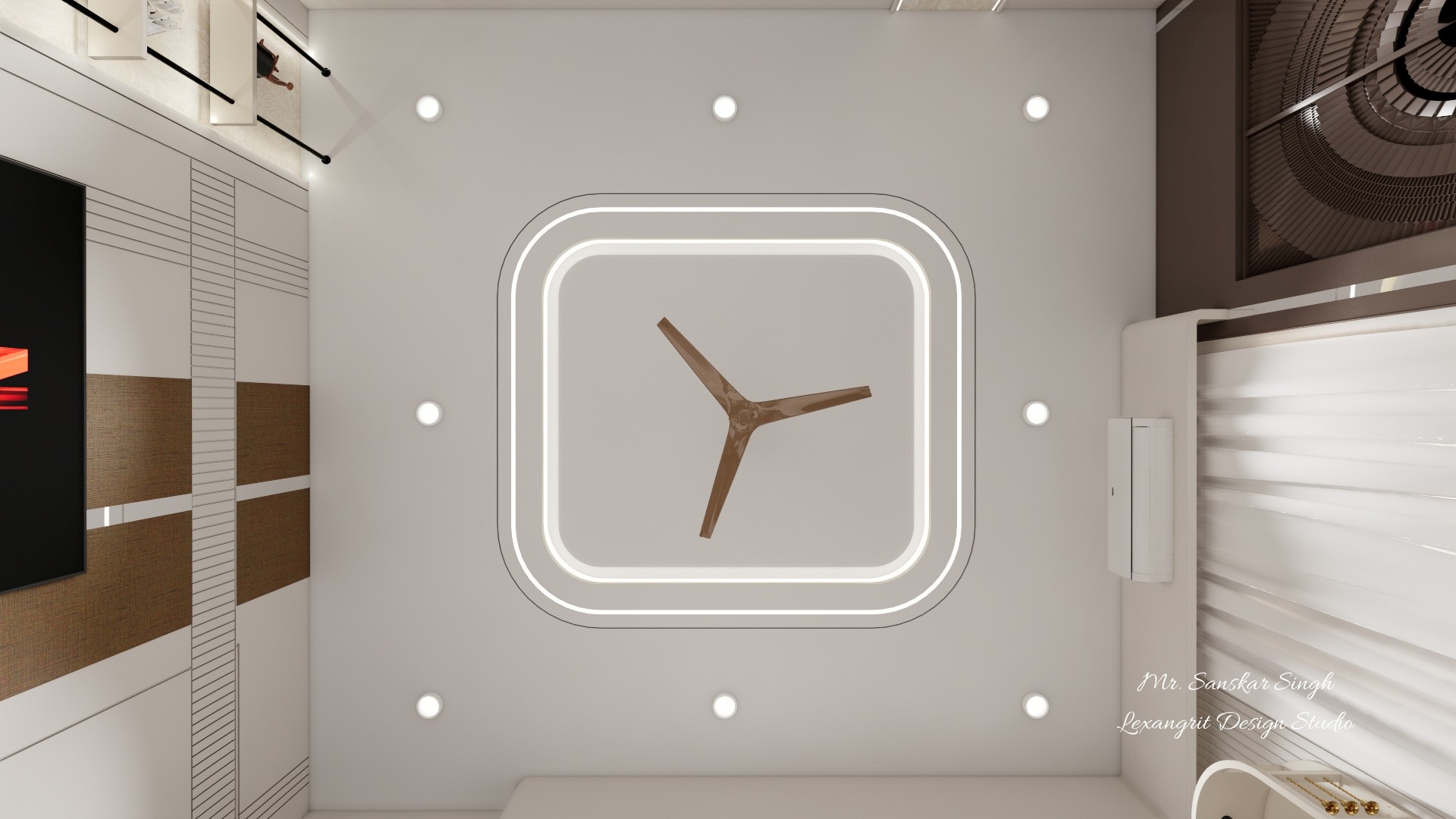 Ceiling detail with a glowing rounded rectangular recess, wood-tone fan, evenly spaced downlights, and glimpses of a patterned television wall.