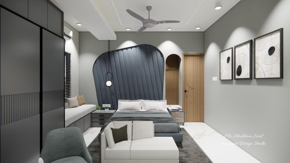 master bedroom blue foam padding bedback with a king size bed and side tables on the both side and a dressing mirror on the right and on the left a wardrobe and bay window