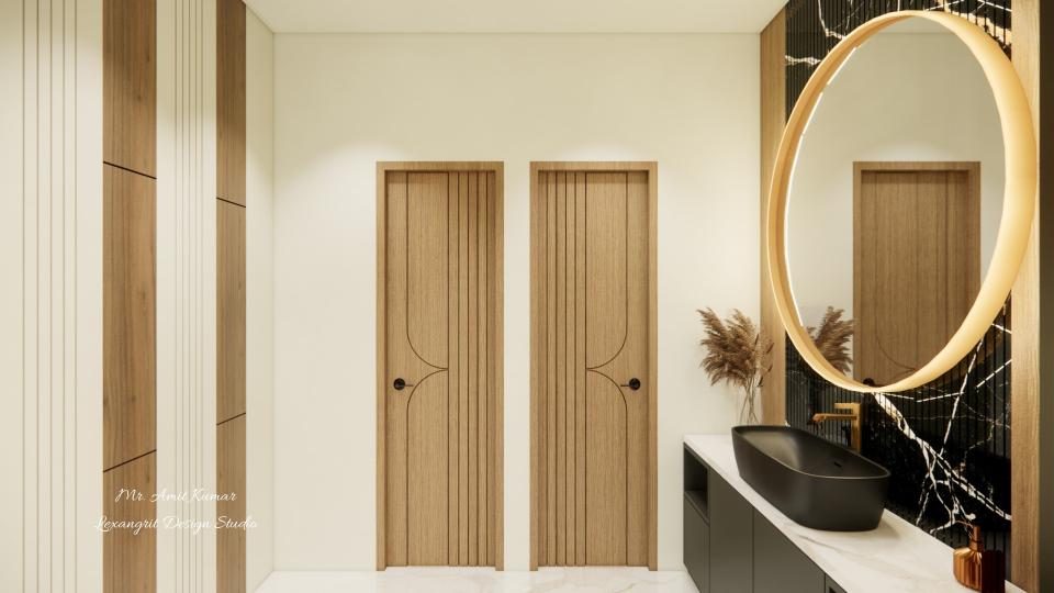 A view of the handwash area showcasing two wooden doors with grooves and a vanity area on the right with a black vessel sink and a large, glowing circular mirror against a black marble wall. while the left wall displays alternating vertical grooved panels of wood and white stripes.