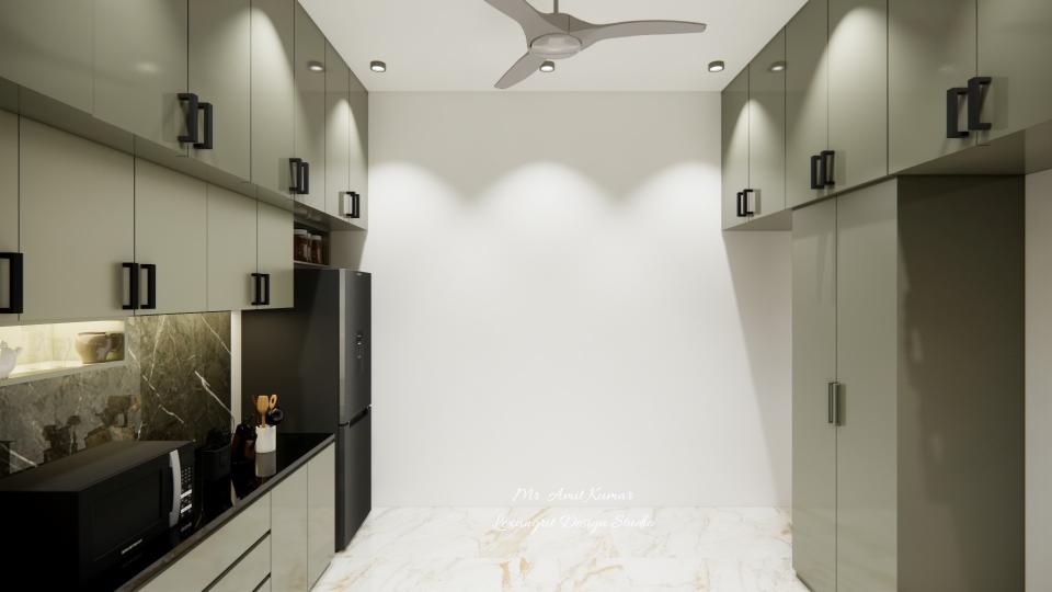 Kitchen passage showing sage green plywood cabinetry with sleek black handles, dark marble-textured dado tile, polished white marble flooring, under-cabinet lighting, tall black refrigerator, built-in microwave, and overhead storage.
