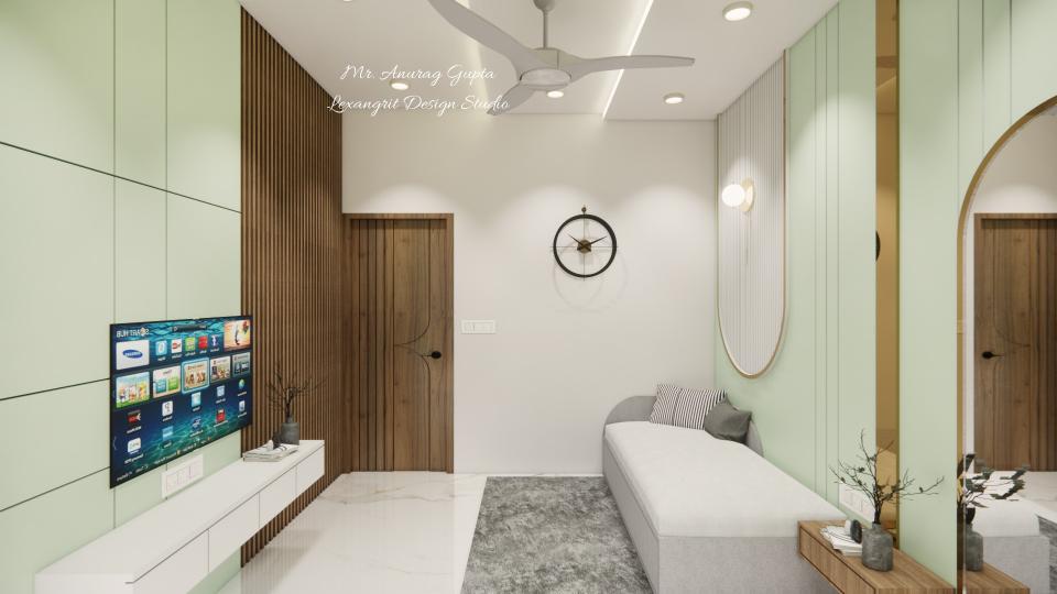 Image of the guest bedroom showcasing a sleek tv unit against a pastel-toned wall