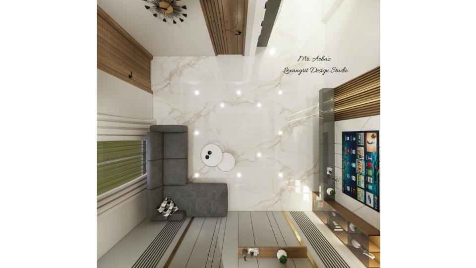 Living room floor plan showing L shaped sofa with coffee table, full wall TV unit, main entrance on right wall, powder bathroom door, Vastu clock on north wall and grey groove cutting wall with golden T patti on south wall by Lexangrit Design Studio