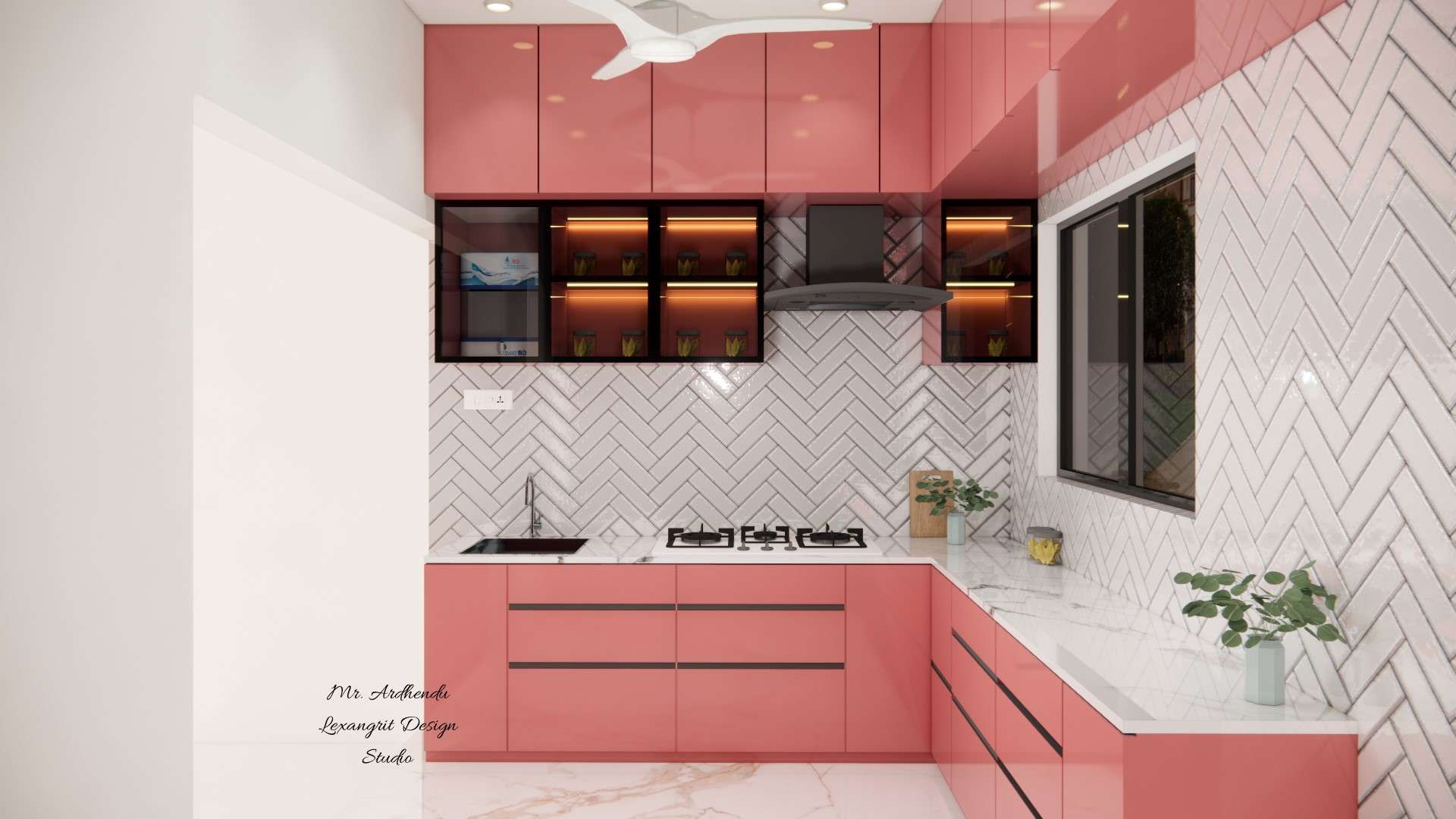 Coral peach L shaped modular kitchen with 3 drawer unit, sink unit, aquaguard unit, glass shutter wall cabinets with internal lights and zigzag pattern white dado tiles by Lexangrit Design Studio