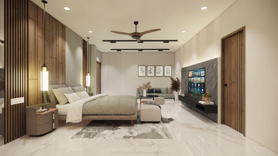 Image of the master bedroom displaying a comfortable seating area with a chaise lounge, side table, and a lamp against a decorated wall