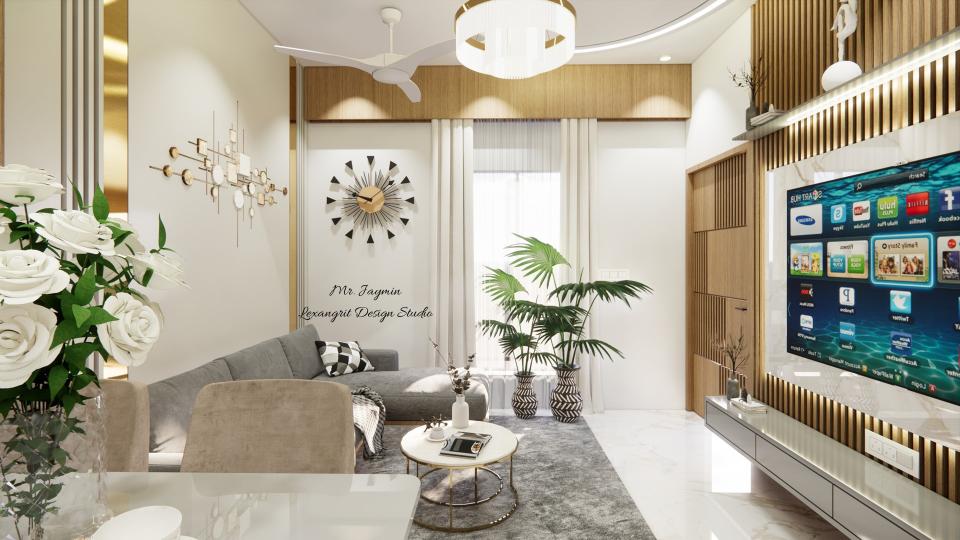 Image of the living room featuring a modern entertainment center with a flat-screen TV and built-in shelves against a sleek accent wall