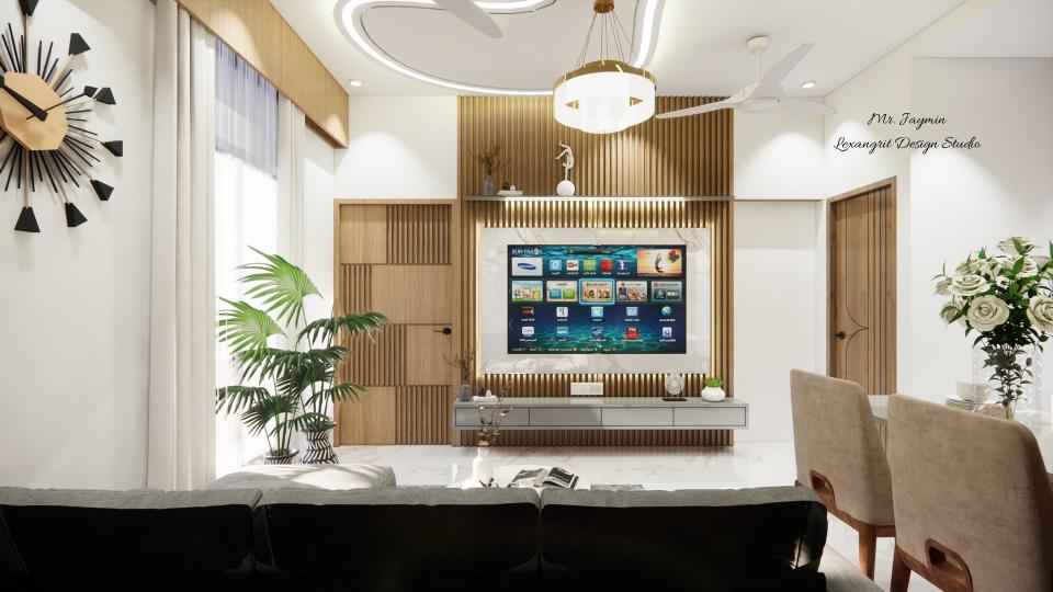 Image of the living room featuring a modern entertainment center with a flat-screen TV and built-in shelves against a sleek accent wall