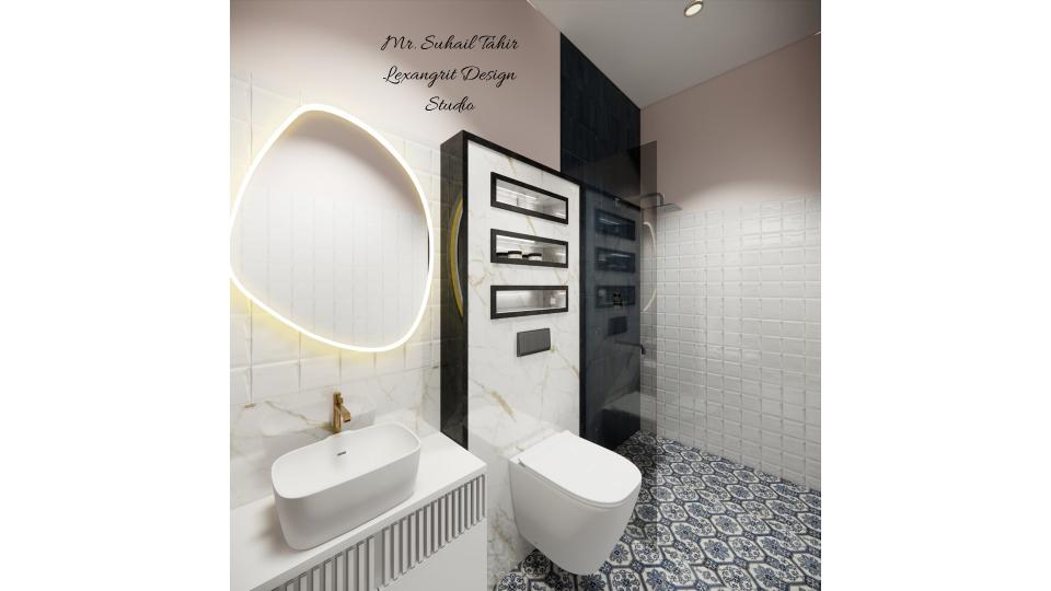 Image of the bathroom showcasing a spacious shower area with a glass partition and modern fixtures against a tiled wall