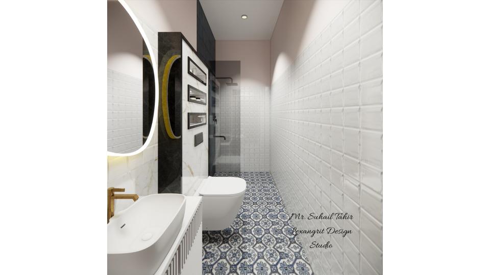 image of the bathroom showcasing a spacious shower area with a glass partition and modern fixtures against a tiled wall