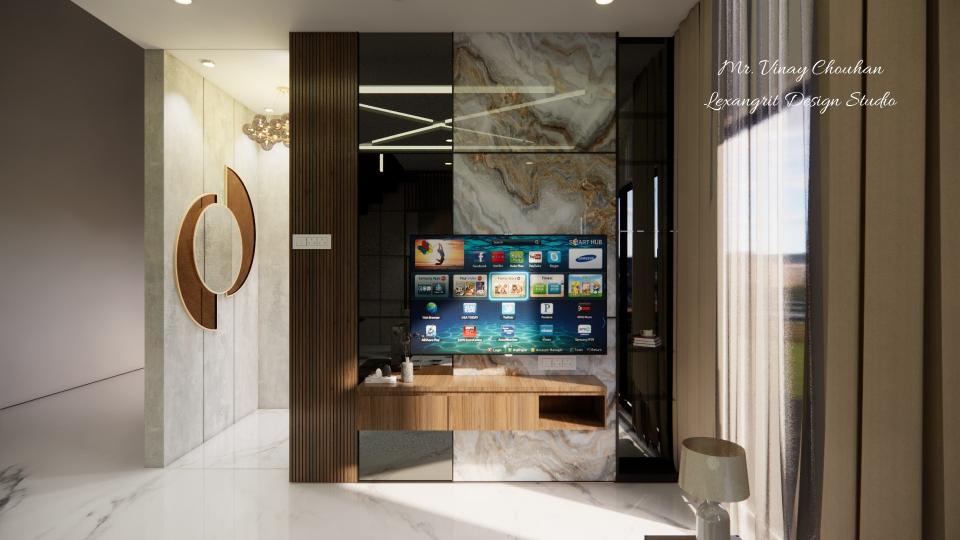 Image of the living room featuring a modern entertainment center with a flat-screen TV and built-in shelves against a sleek accent wall