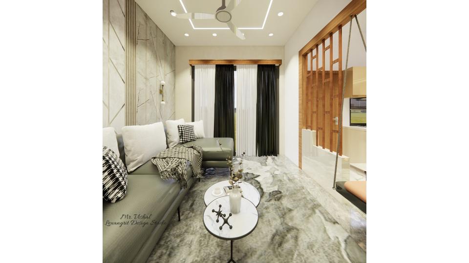 Image of the living room displaying a cozy reading nook with a plush armchair, and a center table against a tastefully decorated wall