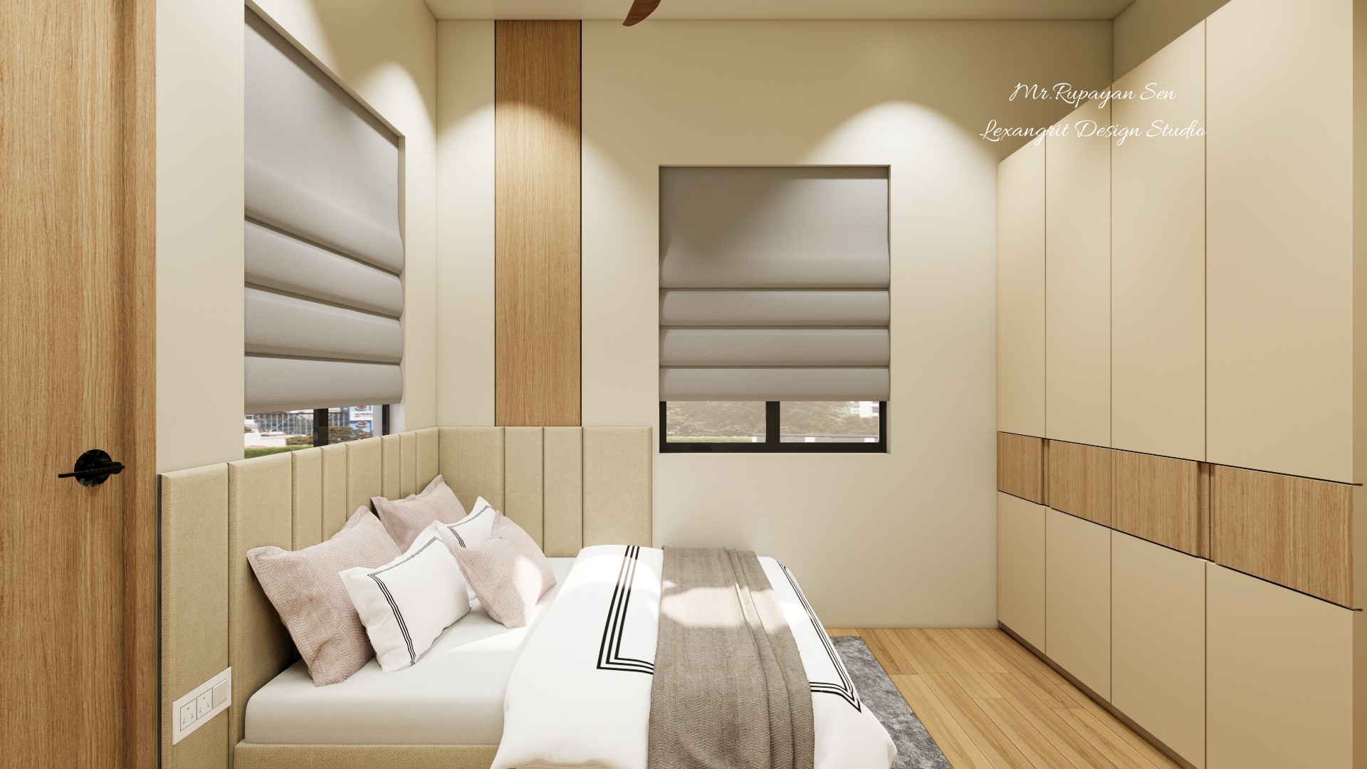 Neutral bedroom with a pale upholstered bed, striped bedding, light wood cabinets, and gray roller shades.