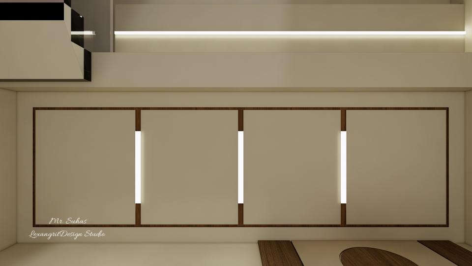 Here we can see the Ceiling of the lobby designed with a minimal grid kind of pattern with profile lights subjected to it with a dark groove finish .