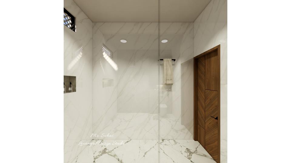 In this image we can see a bahtroom with full height wall tiles with grey and white mixed texture italian marble finish and black texture blend floor tiles,door is designed with zig-zag wooden laminated deisgn pattern ,cloth hanger is placed beside the door wall,niche is given for minimal storage.