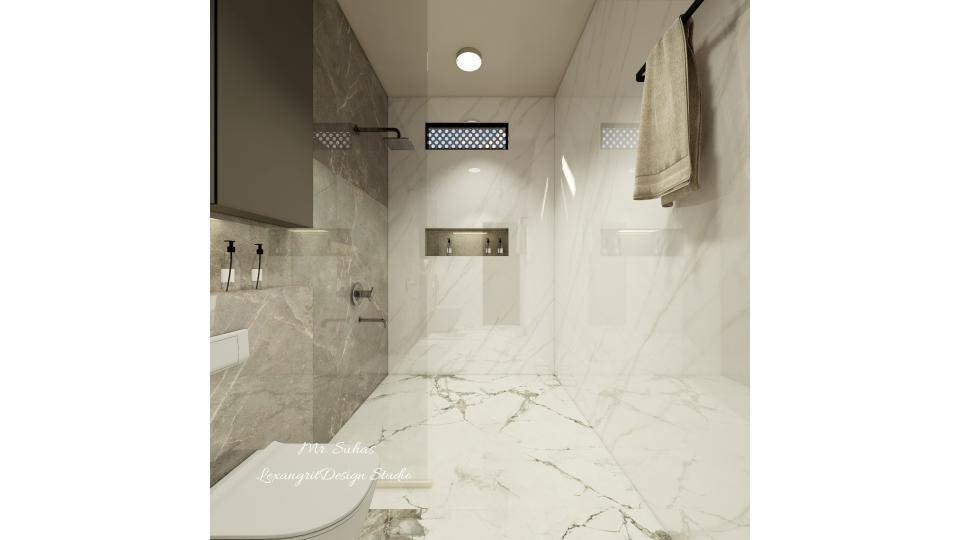 In this image we can see wall mounted Wc is placed at left wall with storage at top wth grey matt finished laminate ,Glass partition is given to seperate dry and wet Area.niche is given for minimal storage,Shower & wc wall desgned with ash grey textured tiles ,remaining walls are designed  with grey and white mixed texture italian marble finish and black texture blend floor tiles.