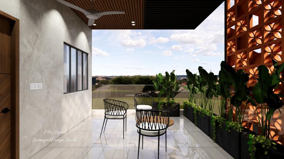 In this view we can see the seating is given at  the centre with three chairs & a centre table,placed plantery boxes around the railing ,terracoota brick wall is designed for natural look and it reduces heat, window & door wall is designed with ash grey textured full wall tiles,flooring with grey matte linear tiles,ceiling with a combination of pvc panels.