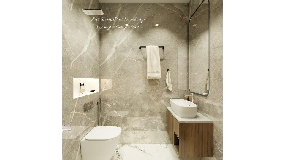 A bathroom balanced in grey — wall tiles in soft grey, WC with niche on the left, countertop basin on a WPC wooden vanity on the right, and a towel hanger within reach.