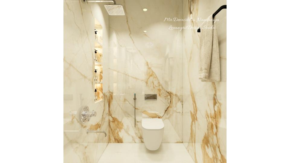 Floor mounted WC gives the rich look for this bathroom,on left wall niche storage acts as minimal storage space for shower area & towel hanger on the right wall.