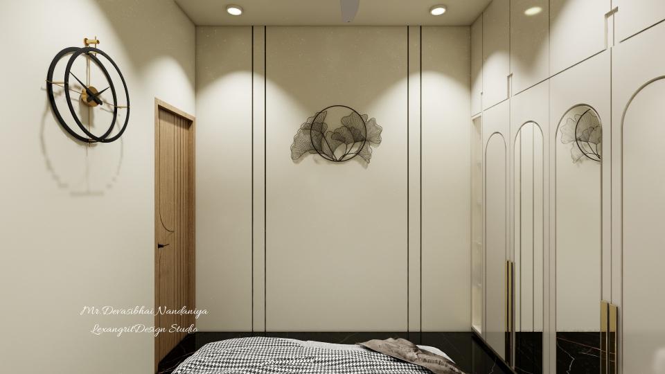 Seamless built-in storage showcases full-height cabinetry with chic arched paneling and slender gold handles, maximizing space without sacrificing style.• A sculptural wire-frame artwork and oversized floating clock create a curated gallery effect, injecting artistic flair into the minimalist canvas.• Soft recessed spotlights wash the ivory walls in a warm glow, accentuating clean vertical lines and the subtle sheen of high-gloss finishes.• Dramatic black marble flooring anchors the design, introducing bold contrast that elevates the serene neutral palette.• This refined blend of sculptural accents, clever storage, and luxurious materials offers clients a polished, clutter-free retreat.