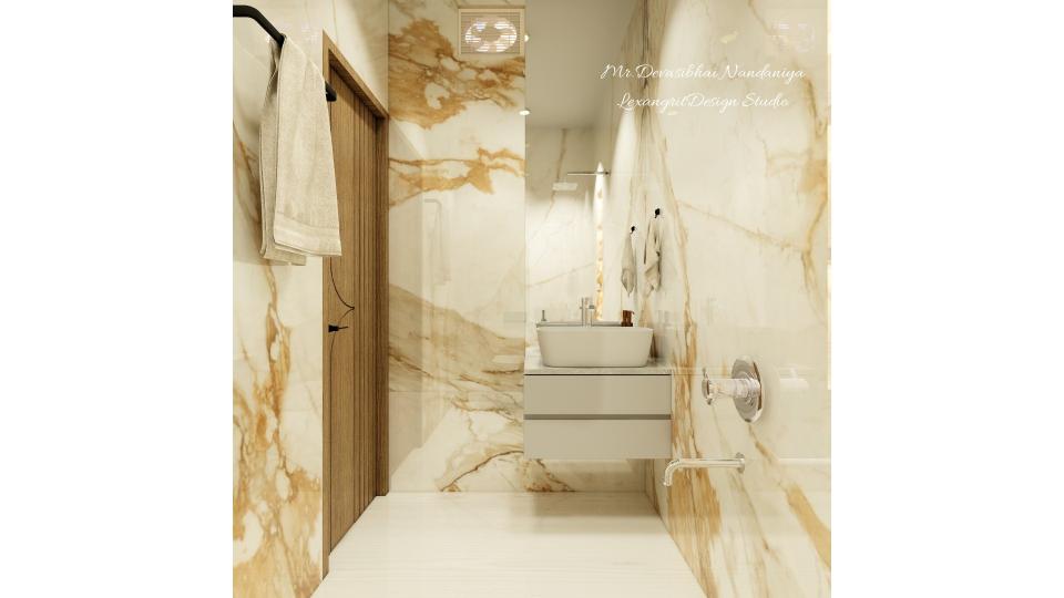 the counter top wash basin acts as main accent of the washroom with full mirror and vanity storage below,WPC is used for vanity storage with grey laminate finish,on left wall towel hanger is placed & on right wall shower unit is placed accordingly.