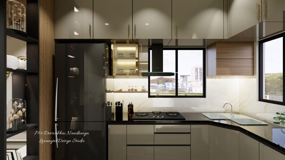 Modern kitchen view with black quartz countertop, beige acrylic laminate cabinets with matte concealed handles, brass loft handles, pullout drawers, magic corner, hob chimney setup and fluted glass unit.