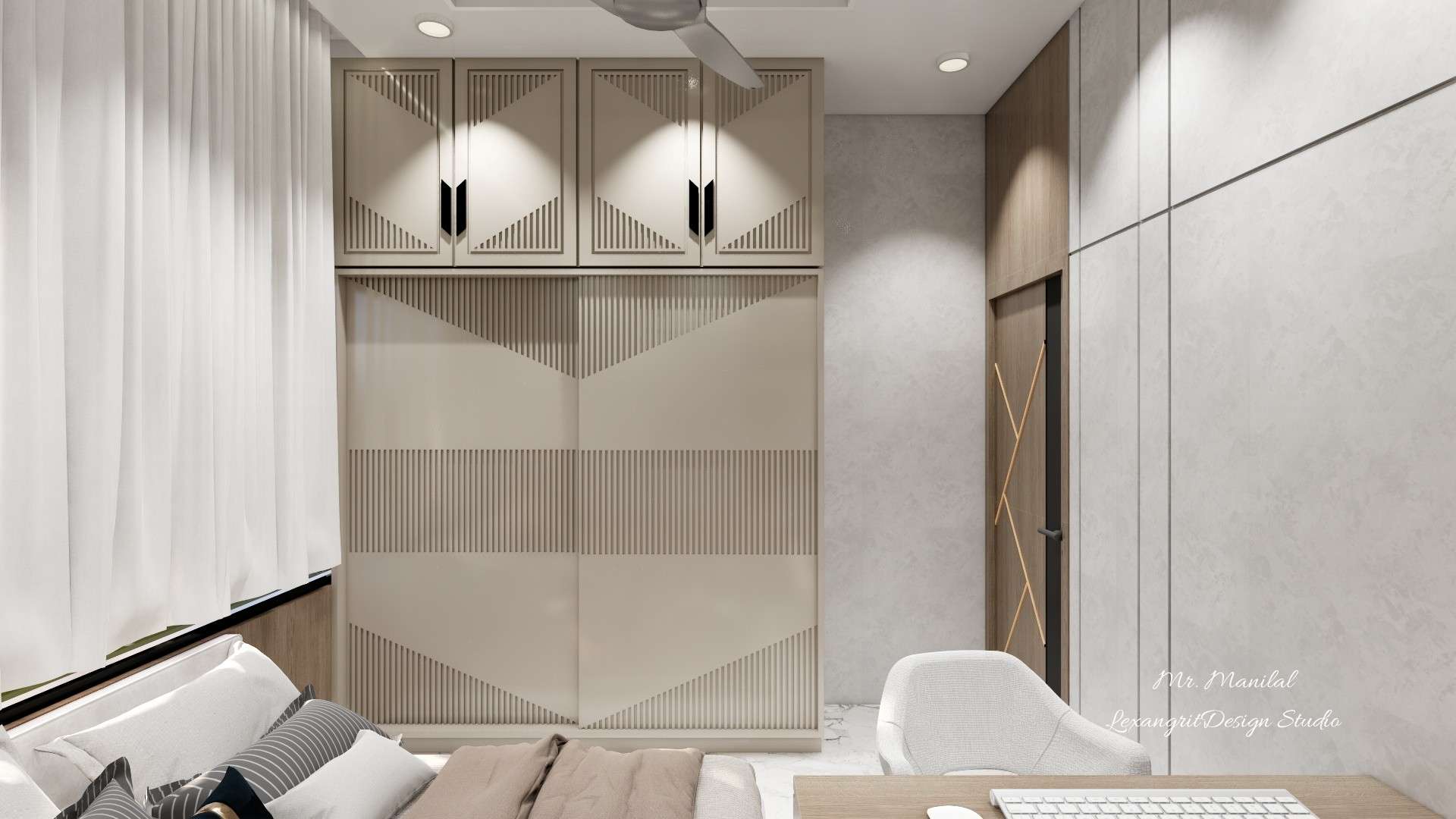 Ultra-matt beige sliding wardrobe with groove-cut shutters, custom black handles, and matching loft storage in a modern bedroom.