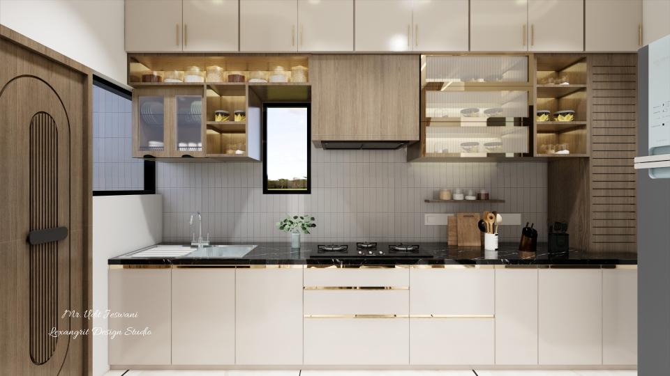 Kitchen counter finished with black quartz, featuring base units made of uPVC or HDHMR with acrylic beige laminate and sleek brass handles, middle cabinets in wooden finish with fluted glass and brass frames, and loft units in HDHMR or plywood with acrylic laminate and linear profile handles.